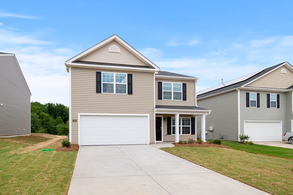 Suburban house with a driveway and front lawn