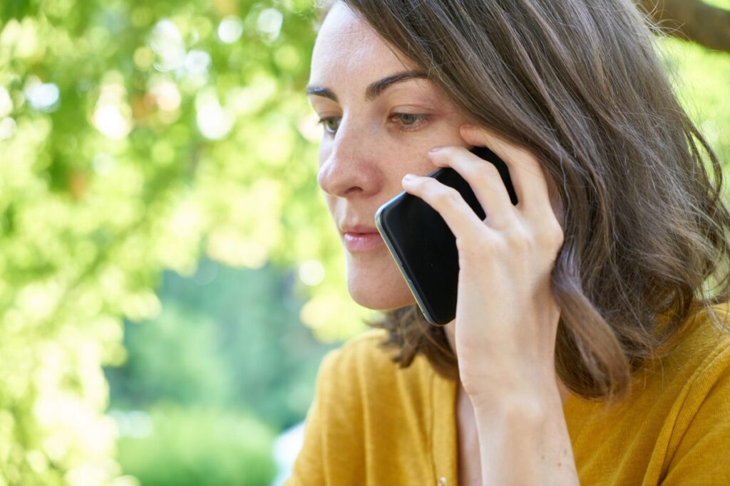 A woman taking an international call outdoors
