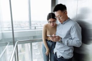 Two people looking at a phone together